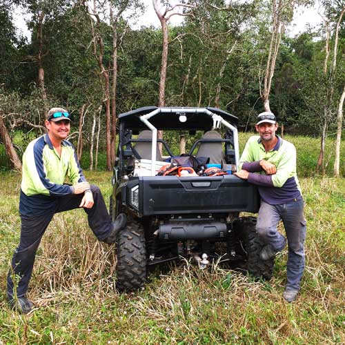 Terrain NRM ground crew with ATV and pond apple in background